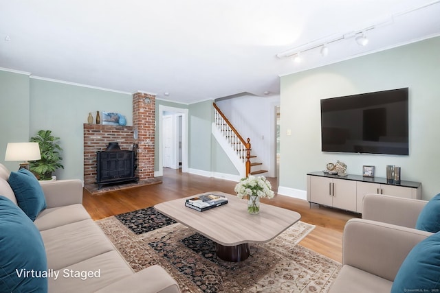 127 Matson Hill Rd, Glastonbury, CT 06073 - living room featuring stairway, wood finished floors, crown molding, baseboards, and track lighting