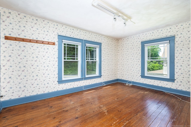 127 Matson Hill Rd, Glastonbury, CT 06073 - unfurnished room with track lighting, wallpapered walls, hardwood / wood-style flooring, and baseboards