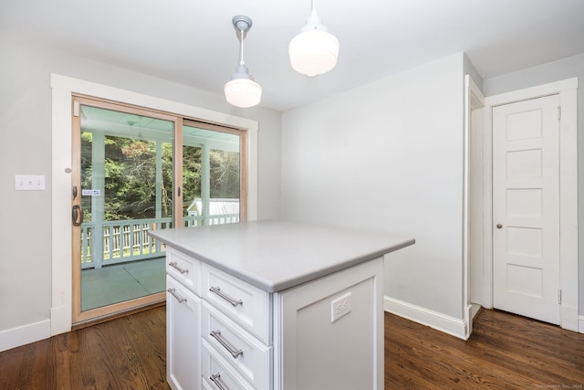 127 Matson Hill Rd, Glastonbury, CT 06073 - kitchen with baseboards, white cabinetry, dark wood finished floors, light countertops, and decorative light fixtures