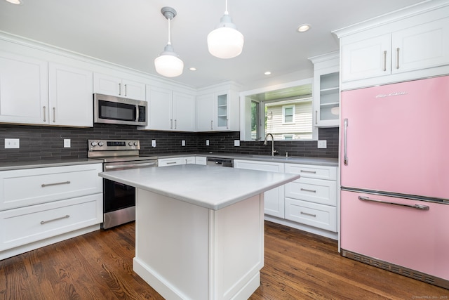 127 Matson Hill Rd, Glastonbury, CT 06073 - kitchen featuring appliances with stainless steel finishes, a sink, glass insert cabinets, decorative backsplash, and white cabinets