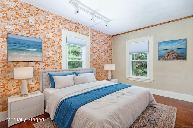 127 Matson Hill Rd, Glastonbury, CT 06073 - bedroom with rail lighting, wood finished floors, multiple windows, baseboards, and wallpapered walls