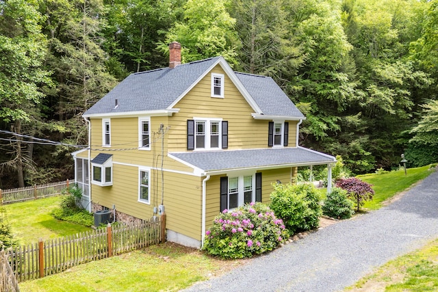 127 Matson Hill Rd, Glastonbury, CT 06073 - view of front facade with a chimney, a shingled roof, a view of trees, and central AC