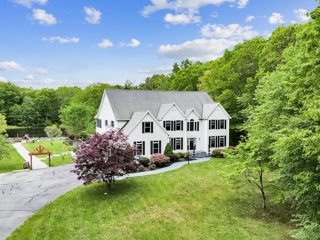 19 Cedarbrook Ln, East Lyme, CT 06333 - view of front facade with a forest view and a front yard