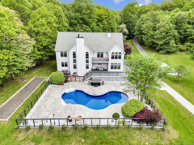 19 Cedarbrook Ln, East Lyme, CT 06333 - back of house featuring a chimney, a fenced backyard, a balcony, stairway, and an outdoor pool