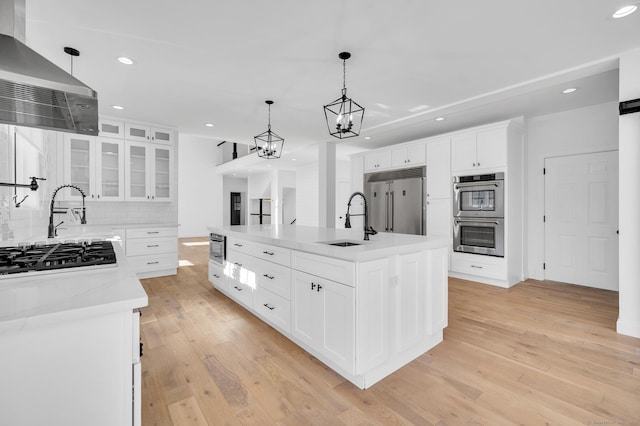 19 Cedarbrook Ln, East Lyme, CT 06333 - kitchen featuring appliances with stainless steel finishes, a sink, wall chimney range hood, recessed lighting, and backsplash