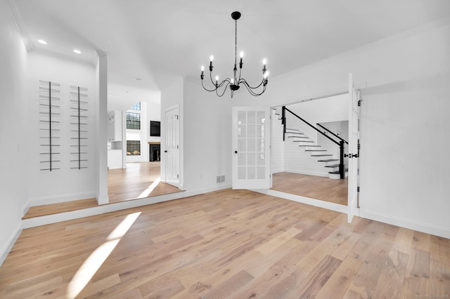 19 Cedarbrook Ln, East Lyme, CT 06333 - unfurnished dining area featuring light wood-style flooring, stairs, baseboards, a chandelier, and recessed lighting