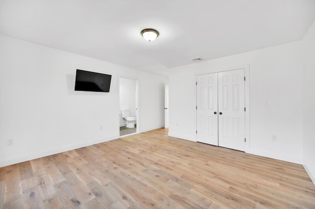 19 Cedarbrook Ln, East Lyme, CT 06333 - unfurnished bedroom featuring light wood-style floors, baseboards, a closet, and connected bathroom