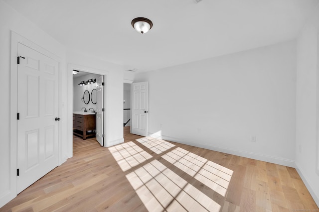 19 Cedarbrook Ln, East Lyme, CT 06333 - unfurnished bedroom with light wood finished floors and baseboards