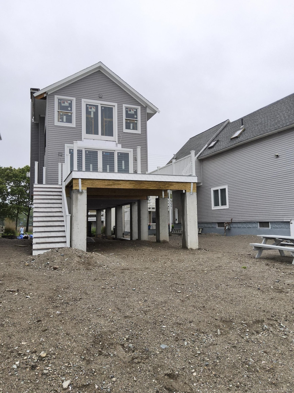 43 Melba St, Milford, CT 06460 - back of house featuring stairs and a carport