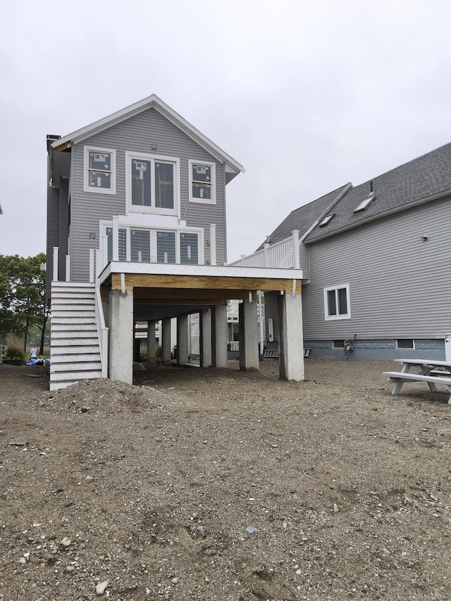 43 Melba St, Milford, CT 06460 - back of house featuring stairs and a carport