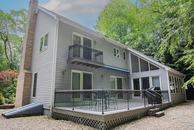 43 Metacomet Rd, Farmington, CT 06032 - rear view of property with a balcony, a chimney, and a deck