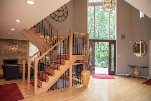43 Metacomet Rd, Farmington, CT 06032 - foyer entrance featuring wood finished floors, a high ceiling, recessed lighting, stairway, and healthy amount of natural light