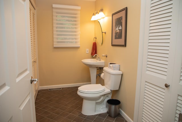 43 Metacomet Rd, Farmington, CT 06032 - half bathroom with toilet, tile patterned floors, baseboards, and a closet