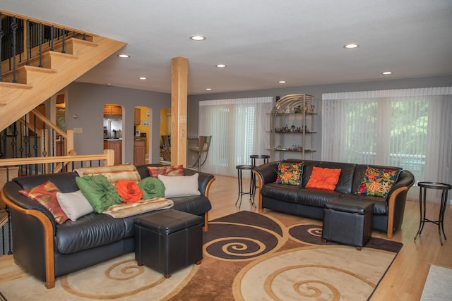 43 Metacomet Rd, Farmington, CT 06032 - living area featuring healthy amount of natural light, wood finished floors, stairway, and recessed lighting