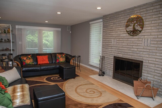 43 Metacomet Rd, Farmington, CT 06032 - living area with a fireplace, recessed lighting, wood finished floors, and baseboards