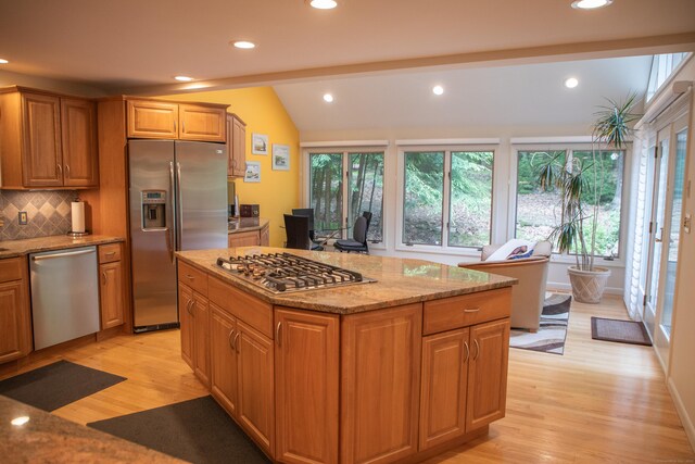 43 Metacomet Rd, Farmington, CT 06032 - kitchen with appliances with stainless steel finishes, light wood finished floors, plenty of natural light, vaulted ceiling, and recessed lighting