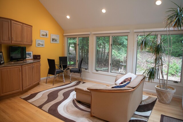 43 Metacomet Rd, Farmington, CT 06032 - living area featuring healthy amount of natural light, light wood-style floors, an office area, recessed lighting, and lofted ceiling