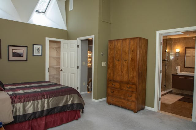 43 Metacomet Rd, Farmington, CT 06032 - bedroom featuring a skylight, a high ceiling, carpet, a spacious closet, and baseboards