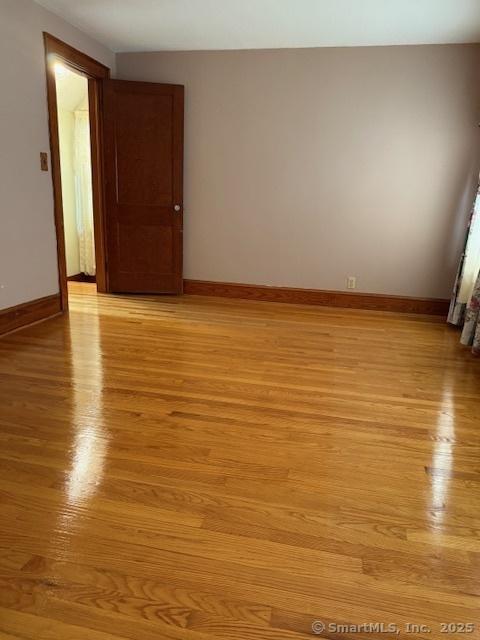 11 Deerfield St, East Haven, CT 06512 - unfurnished room with light wood-style floors and baseboards