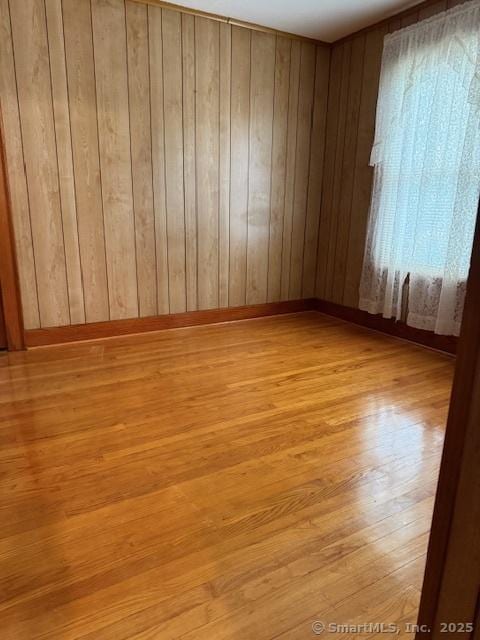11 Deerfield St, East Haven, CT 06512 - spare room featuring light wood finished floors and wooden walls