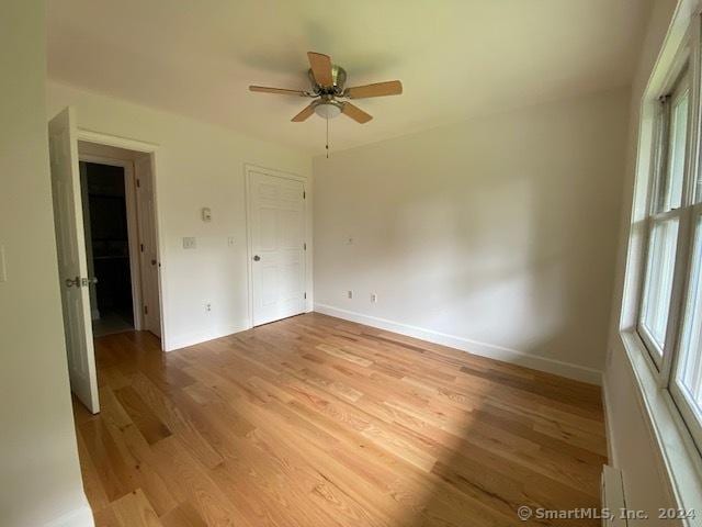 57 Senior Dr Unit 57, Monroe, CT 06468 - unfurnished room with plenty of natural light, ceiling fan, light wood-style floors, and baseboards