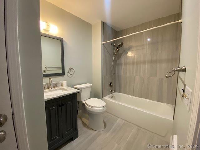 57 Senior Dr Unit 57, Monroe, CT 06468 - full bathroom with toilet, vanity, washtub / shower combination, and wood finished floors