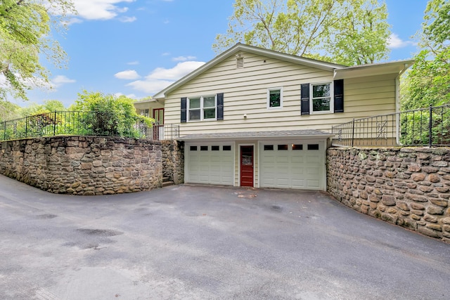 44 Josies Ring Rd, Monroe, CT 06468 - view of property exterior featuring a garage, asphalt driveway, and stairway