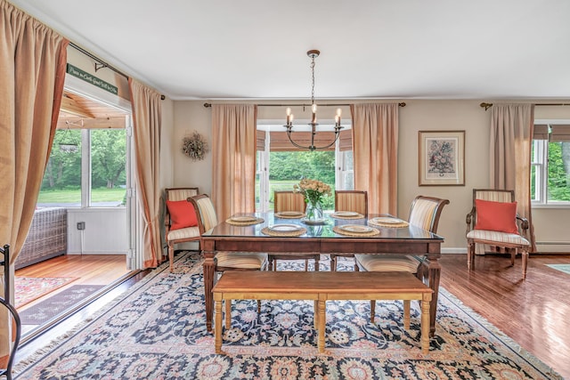 44 Josies Ring Rd, Monroe, CT 06468 - dining space featuring wood finished floors, a chandelier, and a baseboard radiator