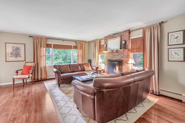 44 Josies Ring Rd, Monroe, CT 06468 - living area featuring a fireplace, light wood-style floors, and a baseboard radiator