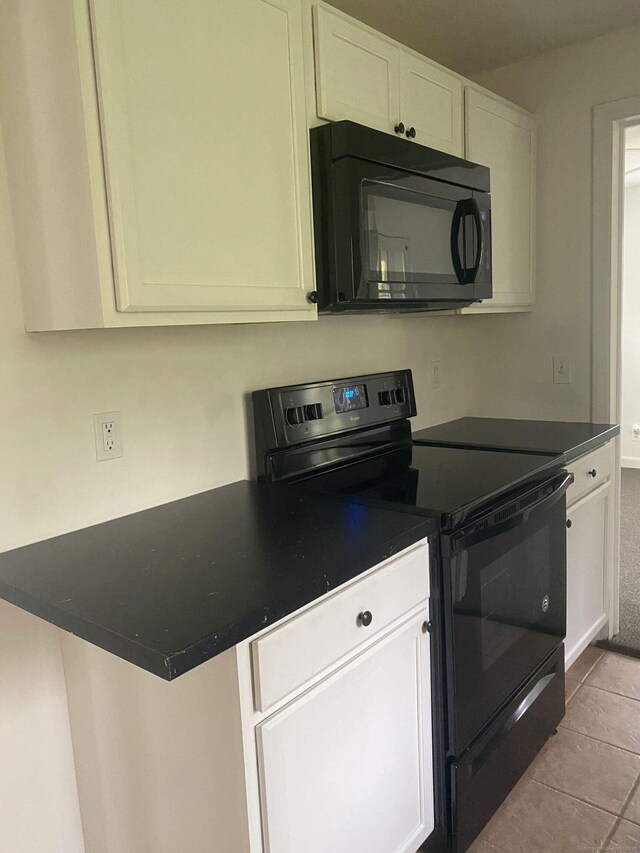 44 Josies Ring Rd, Monroe, CT 06468 - kitchen with black appliances, dark countertops, white cabinetry, and tile patterned floors