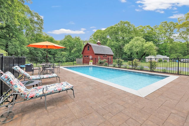 44 Josies Ring Rd, Monroe, CT 06468 - view of pool with view of wooded area, a patio area, and an outdoor structure