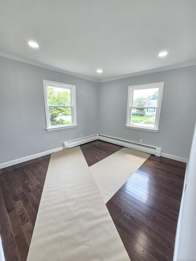 206 Bridgeview Pl, Stratford, CT 06614 - spare room featuring crown molding, healthy amount of natural light, dark wood finished floors, recessed lighting, and baseboards