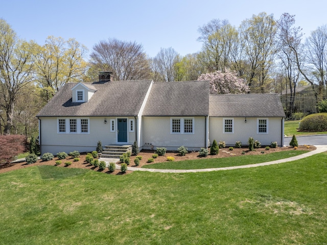 27 Powderhorn Dr, Ridgefield, CT 06877 - new england style home with a front yard, a chimney, and a shingled roof