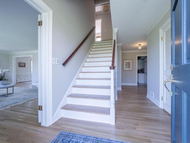 27 Powderhorn Dr, Ridgefield, CT 06877 - staircase featuring a baseboard radiator, ornamental molding, wood finished floors, and baseboards