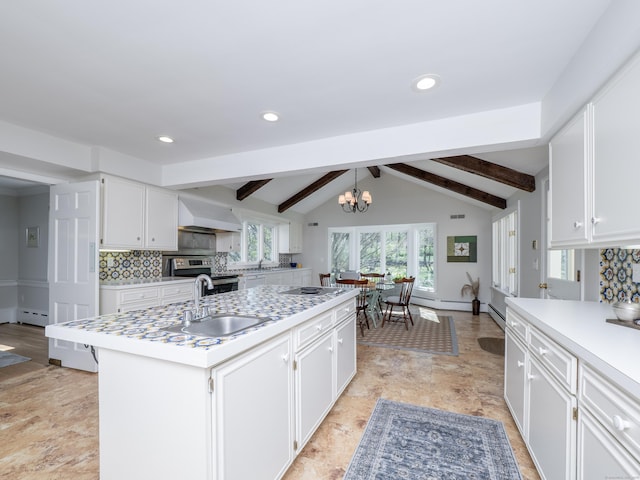 27 Powderhorn Dr, Ridgefield, CT 06877 - kitchen featuring stainless steel electric range, a sink, light countertops, a chandelier, and recessed lighting