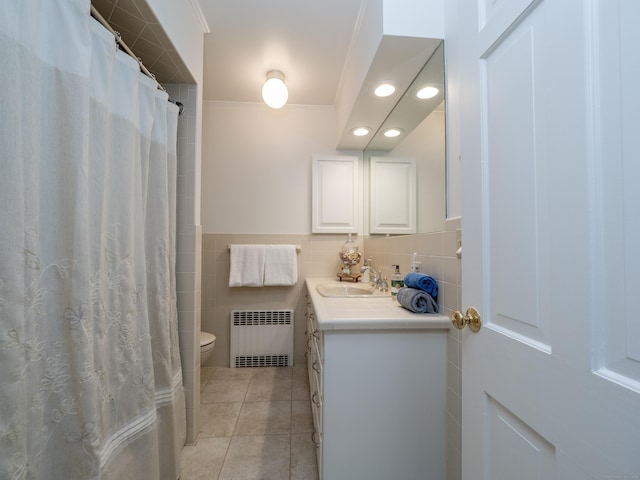 27 Powderhorn Dr, Ridgefield, CT 06877 - full bathroom with radiator, vanity, toilet, tile patterned flooring, and tile walls