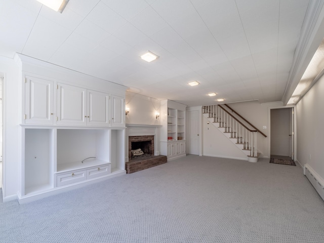 27 Powderhorn Dr, Ridgefield, CT 06877 - unfurnished living room featuring light colored carpet, stairs, a brick fireplace, a baseboard radiator, and baseboards