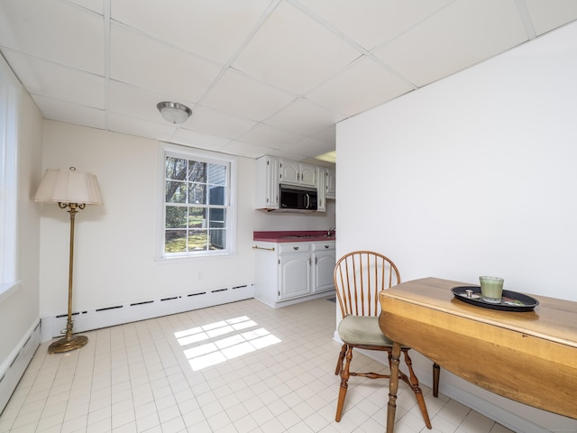 27 Powderhorn Dr, Ridgefield, CT 06877 - dining space with a drop ceiling, a baseboard radiator, baseboards, and light tile patterned flooring