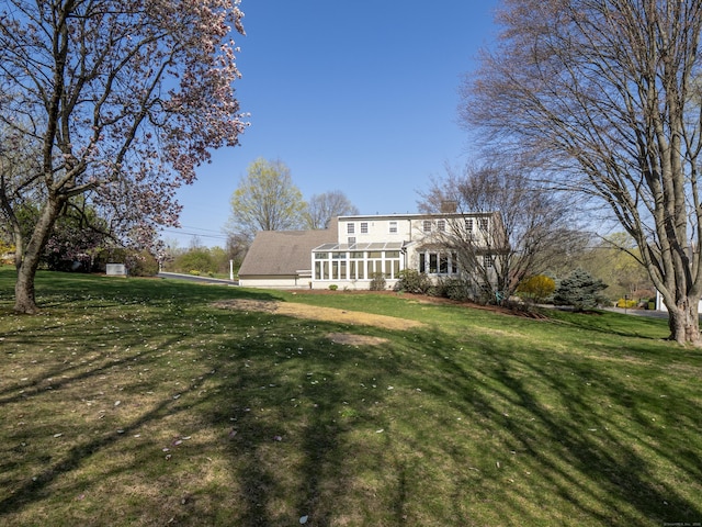 27 Powderhorn Dr, Ridgefield, CT 06877 - view of front facade featuring a chimney and a front yard