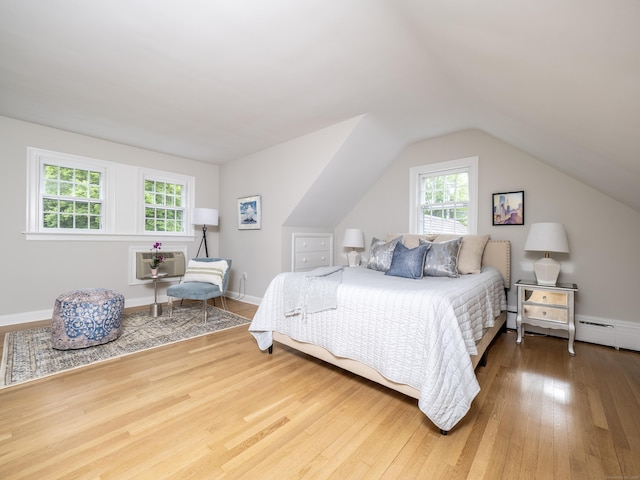 27 Powderhorn Dr, Ridgefield, CT 06877 - bedroom featuring a wall mounted air conditioner, wood finished floors, and lofted ceiling
