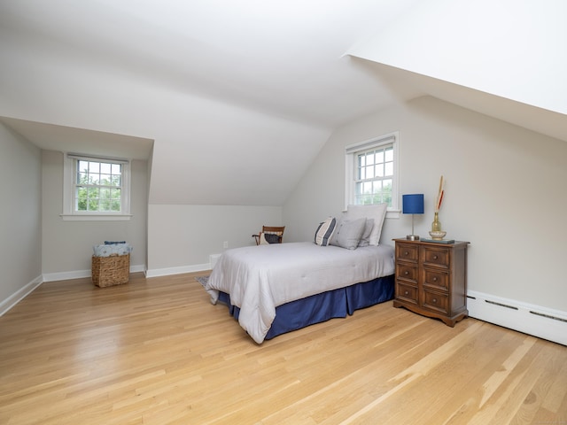 27 Powderhorn Dr, Ridgefield, CT 06877 - bedroom featuring light wood-style flooring, multiple windows, vaulted ceiling, and a baseboard heating unit