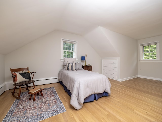27 Powderhorn Dr, Ridgefield, CT 06877 - bedroom featuring light wood-style floors, multiple windows, lofted ceiling, baseboard heating, and baseboards