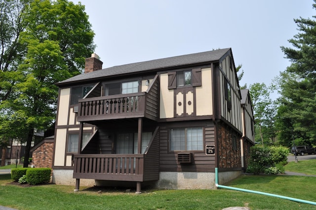 12 Derby Ct Unit 12, Brookfield, CT 06804 - rear view of property featuring a balcony, a yard, and a chimney