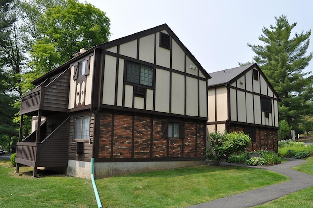 12 Derby Ct Unit 12, Brookfield, CT 06804 - view of property exterior with a yard, brick siding, and a balcony