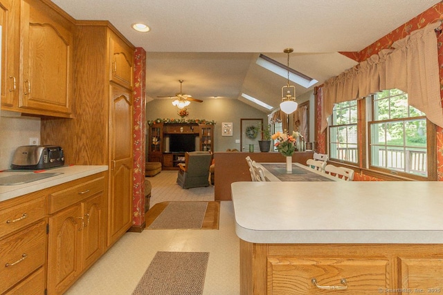 37 Sage Dr, Berlin, CT 06037 - kitchen featuring light countertops, pendant lighting, a ceiling fan, brown cabinetry, and vaulted ceiling