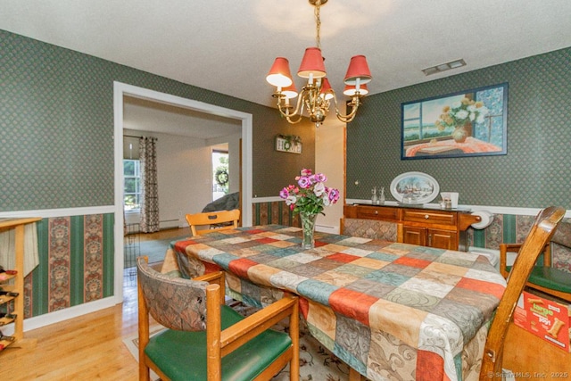 37 Sage Dr, Berlin, CT 06037 - dining room featuring wallpapered walls, a chandelier, and light wood-style flooring