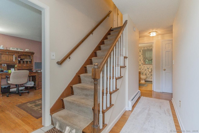 37 Sage Dr, Berlin, CT 06037 - staircase with a baseboard radiator and wood finished floors