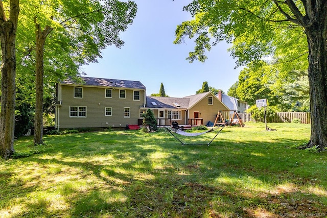 37 Sage Dr, Berlin, CT 06037 - rear view of house with a wooden deck and a playground