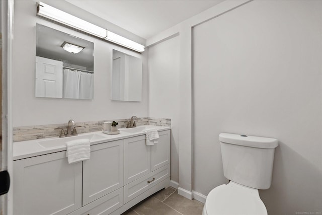 34 Pleasant St Unit 6, Plainfield, CT 06374 - bathroom featuring double vanity, toilet, and baseboards