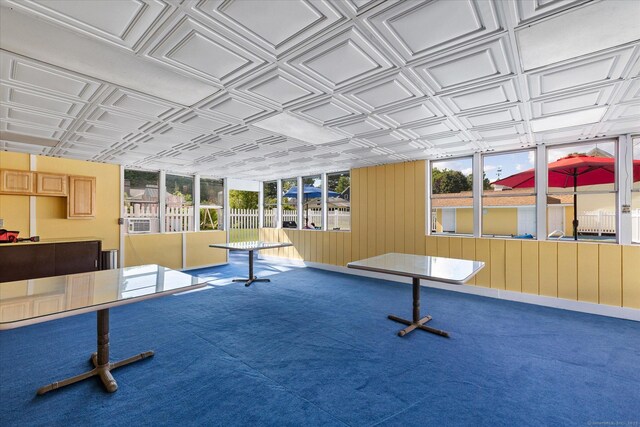 34 Pleasant St Unit 6, Plainfield, CT 06374 - recreation room featuring an ornate ceiling, carpet floors, and wooden walls